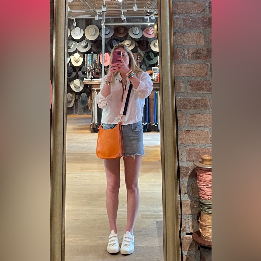 No brand - orange crossbody bag with a navy and white adjustable strap!